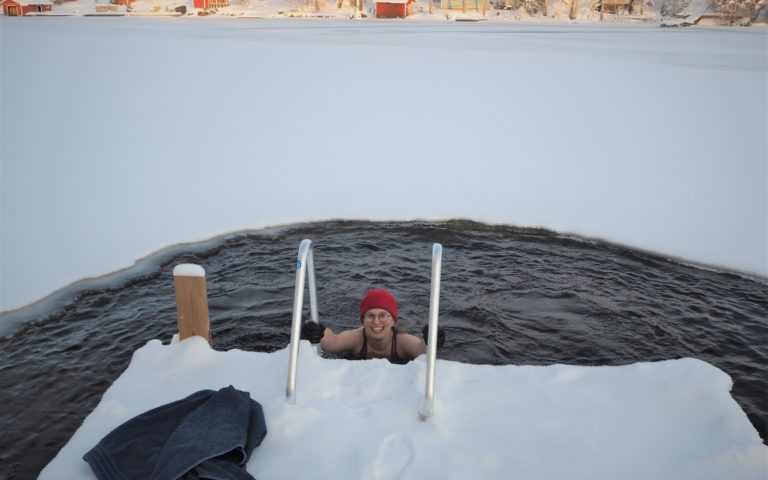 Finnish sauna and ice hole in the lake in Oravi